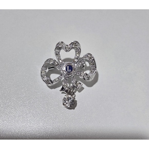 Jewelry - Vintage Lions Club Rhinestone Bow Brooch Pin Silver Tone Blue "L" Dangle Charm